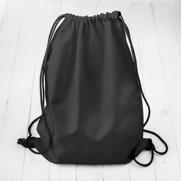 black-backpack-with-strings-planked-surface_143092-3590